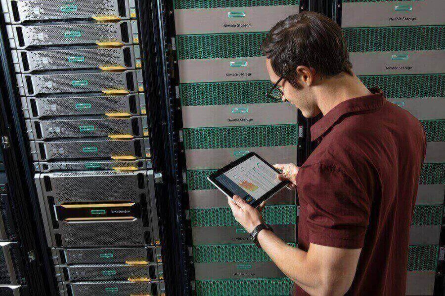 Man with tablet in server room